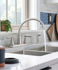 Hutchinson Spot Resist Stainless 2-Handle High Arc Kitchen Faucet With Side Sprayer, No-Fuss Duralock Install, clean modern countertop