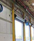 Heavy Duty 30 Inch High Velocity Yoke Mount Fan mounted on warehouse wall for effective cooling and airflow.