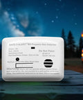 Propane Gas Alarm For RVs And Travel Trailers Surface Mount White 20 Series 20-441-P-WT outdoors with RV at night scene.