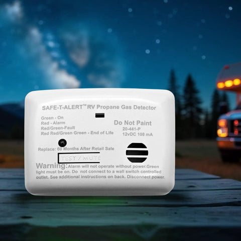 Propane Gas Alarm For RVs And Travel Trailers Surface Mount White 20 Series 20-441-P-WT outdoors with RV at night scene.