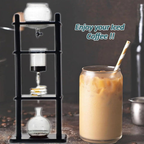 Certified Game Changer Cold Drip Coffee Machine And Iced Coffee Tower With Quick Adjustable Dripper, Massive One Liter Carafe And Sharp Black Stand alongside iced coffee drink.