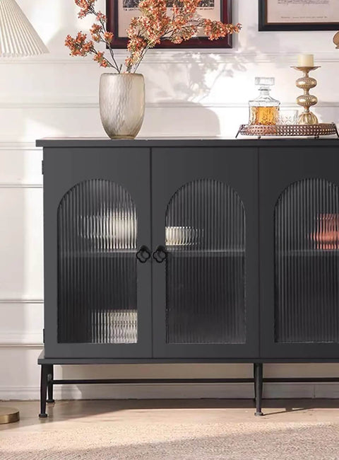 Black cabinet with textured glass doors and decorative items on top, featuring Gold Zinc Alloy Cabinet Knobs for Kitchen and Bathroom.
