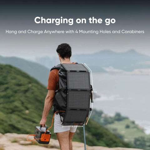 Person hiking with 40W Air Foldable Solar Panel Kit, book-sized PERC bifacial cells, attached to backpack in outdoor setting.