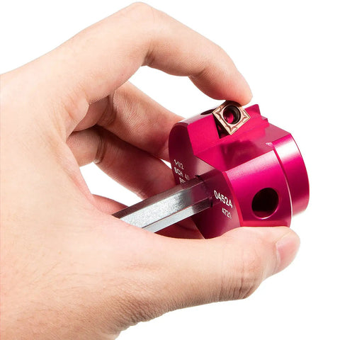 Hand holding reamer from Six Piece Plastic Pipe Fitting Reamer Kit For Standard One Half Inch Drills With Carbide Cutting Inserts In Reamers