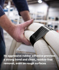 Person using Extra Heavy Duty Industrial Duct Tape 6969, Gray, on large tubes in an industrial setting.
