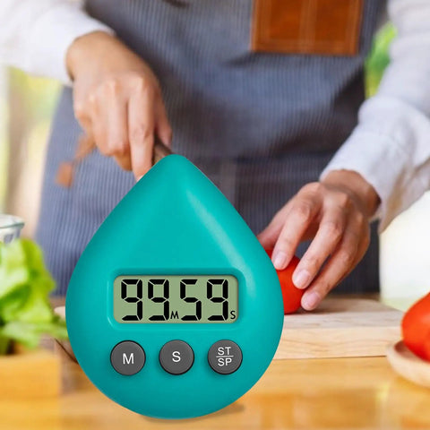 Person chopping vegetables in kitchen with waterproof digital timer with suction cup loud alarm for kitchen cooking visible in foreground