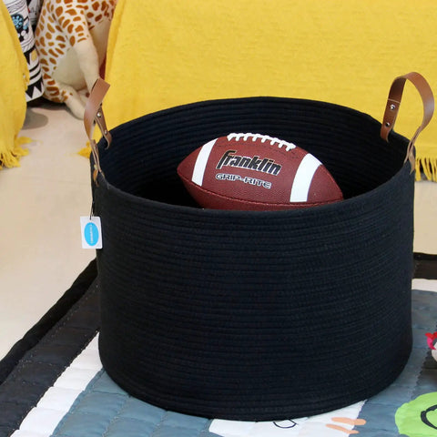 XXXLarge Cotton Rope Storage Basket With Leather Handles For Living Room Go To Organizer For Blankets Towels And Pillows Black 20x20x13 Inches Durable Cotton Rope Craft With Leather Accents For Laundry Or Decorative Storage holding a football