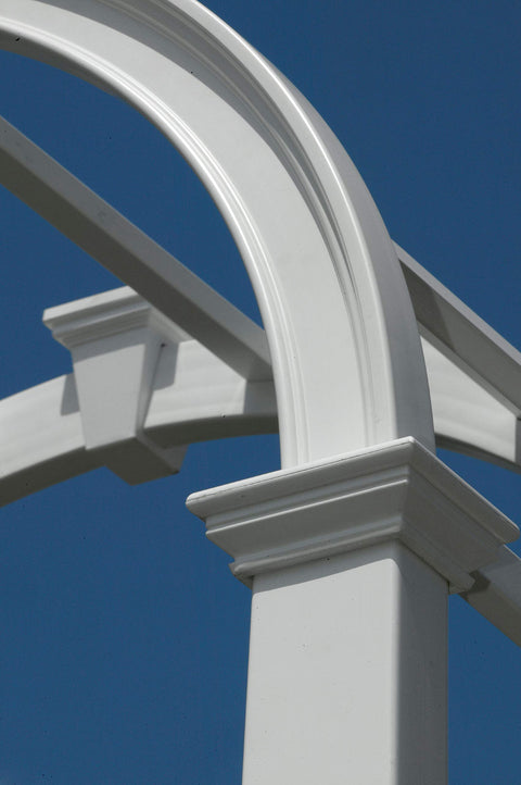 Close-up view of Durable White Vinyl Arbor For Outdoor Garden Pathway 49 Inch Wide By 91 Inch High, No-Fuss Low Maintenance And Easy To Clean, BPA And Phthalate Free, Weather Resistant, Yard Friendly Classic Arbor Design With Twenty Year Warranty showing detailed construction against blue sky.