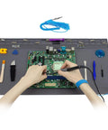 Hands soldering on Extra Large 23.7x13.8 Inch Soldering Mat With ESD Wrist Strap Kit for electronics repair.