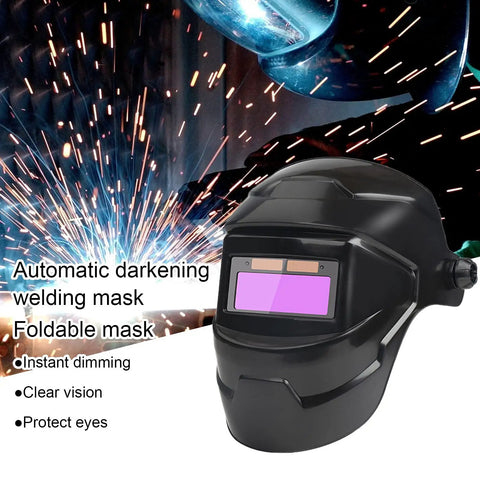 Sun Powered Auto Darkening Welding Helmet With LCD View next to electric welding sparks.