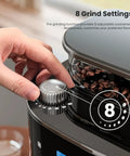 Close-up of hand adjusting grind setting on Fresh Ground Bean To Cup Drip Coffee Maker With Built In Auto Grinder.