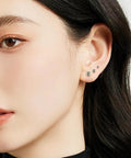 Woman wearing Five Pair Silver Stainless Steel Ball Stud Earrings Set For Women Hypoallergenic Round Studs In 3mm To 7mm Sizes For Everyday Wear And Gift Giving Tarnish Resistant Jewelry Kit Essentials.