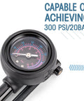 High Pressure Bike Shock Pump With No Loss Schrader Valve dial showing 300 PSI 20 Bar, focused on gauge display for air pressure setting.