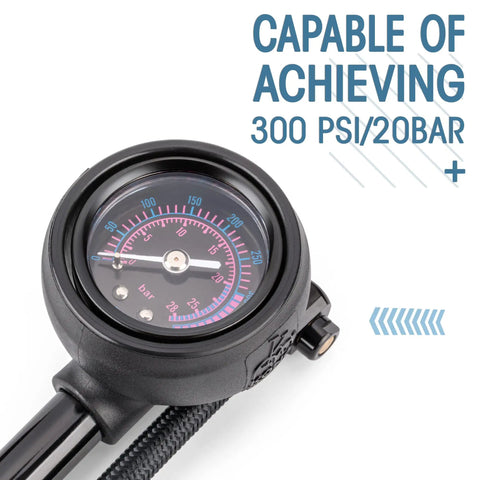 High Pressure Bike Shock Pump With No Loss Schrader Valve dial showing 300 PSI 20 Bar, focused on gauge display for air pressure setting.