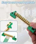 Kickass Neutral Bus Bar 4 Pack 12 Position Brass Terminal Block Industrial Grade Professional For Electrical Panel Grounding Wire Organizer Heavy Duty Connection Kit being held, showcasing brass and green plastic.