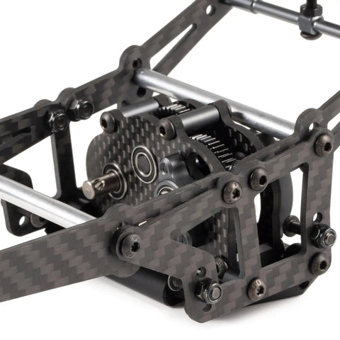 Close-up of Carbon Fiber Lunatic Sporty Chassis Kit With OD3 Overdrive Transmission showing carbon frame detail and gear assembly.