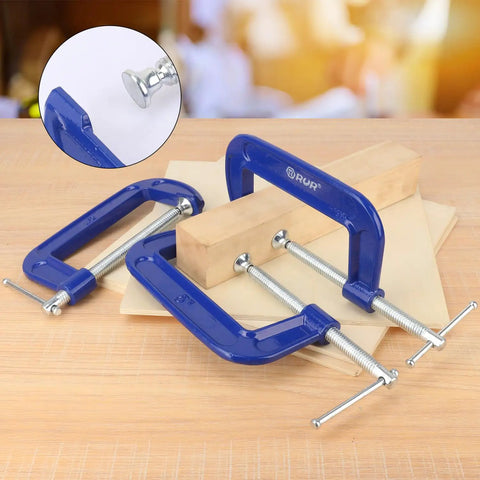 Four Pack 5 Inch Blue C Clamps Heavy Duty Iron Clamps for Woodworking, Welding, and Automotive Use Secure Brake Calipers DIY Projects Building Maintenance and More for DIYers, blue C-clamps on wood