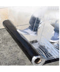 Heavy Duty Self Healing Roofing Underlayment Roll With Super Strong Flashing Sealant shown unrolling on a surface for installation.