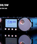 Portable High Performance 16Bit SDR HF Transceiver For SSB CW AM WFM With FT8 Support Versatile QRP Rig For Ham Radio Enthusiasts Clear Reception Easy Tuning Compact Field Setup with digital display on black background.