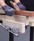 Rock Solid 11 Inch Front Mounted Woodworking Vise For Heavy Duty Workbenches with a plane on wood for clamping tasks.
