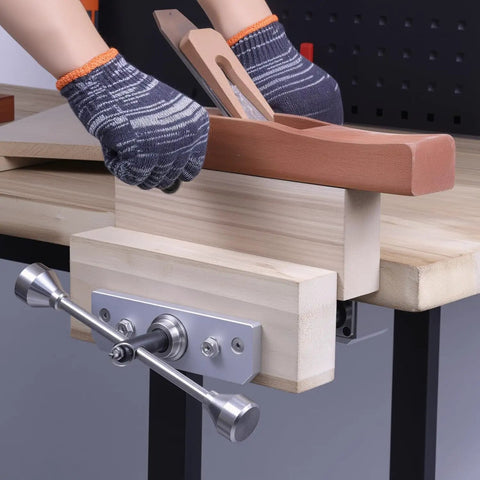 Rock Solid 11 Inch Front Mounted Woodworking Vise For Heavy Duty Workbenches with a plane on wood for clamping tasks.