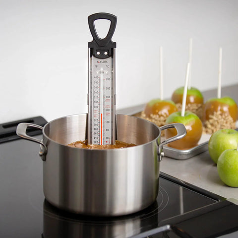 Stainless Steel Candy And Deep Fry Thermometer With 12 Inch Analog Paddle And Pan Clip in pot on stove during candy making