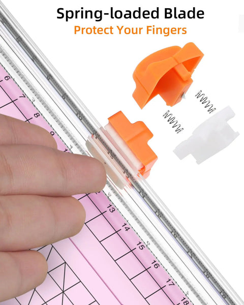 Close-up of Pink A5 Paper Cutter Guillotine With Side Ruler for Scrapbooking showing spring-loaded blade mechanism.