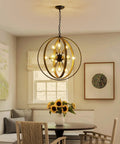 Cozy dining room with 12 Light Farmhouse Dining Room Chandelier With Adjustable Chain In Oak And Brass Finish above table.