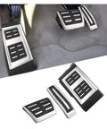 Knockout Clutch Pedal Pads For Vw Touareg 2007 To 2018 showing rubber and stainless steel pedal covers in vehicle interior.