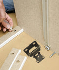 Installation of Self Closing 1/2 Inch Steel Cabinet Hinges with Semiconcealed Design, parts and tools visible for cabinet assembly.