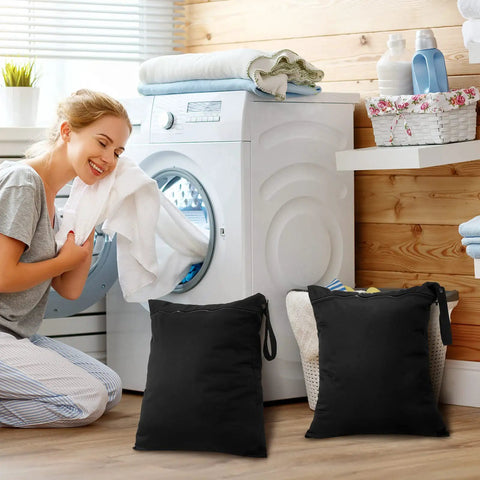 Two Pack Large Travel Laundry Bags Waterproof Wet Dry Bag in laundry room with washing machine and towels