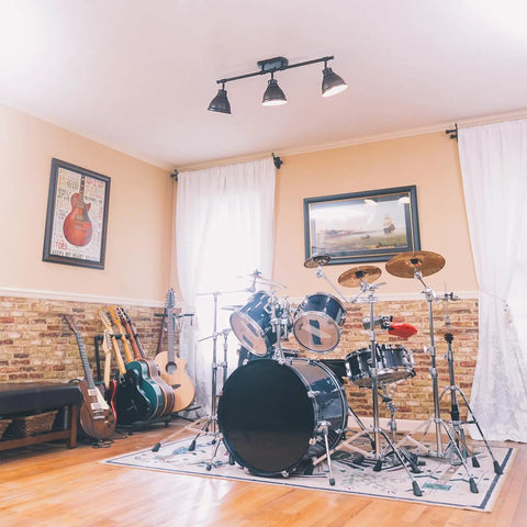 Room with drum set, guitars, and brick accent wall under Duncan Semi Flush Ceiling Light In Rubbed Bronze With Matching Rubbed Bronze Shades
