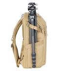 Side view of Metro B30L 30L Camera Backpack With Convertible Daypack in Beige, tripod attached, travel ready carry on for creators on the go.