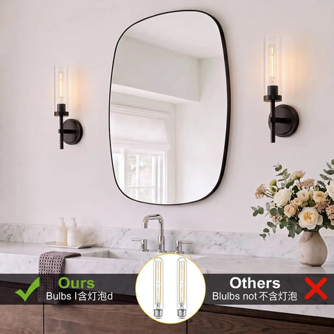 SANTOSTOCK Black Wall Sconces Set of Two in modern bathroom, showcasing clear glass shades and a stylish oval mirror.