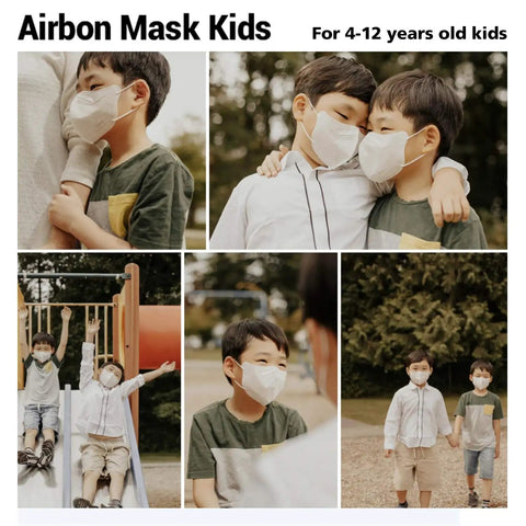 Kids wearing black nanofiber face masks with elastic earloops, enjoying outdoor activities, suitable for ages 4-12
