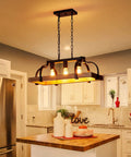 Three Light Metal Pot Hanging Chandelier With Wood Grain Finish Dope Rustic Farmhouse Ceiling Pendant For Kitchen Island And Dining Room Industrial Linear Light Fixture E26 Base Black hanging over kitchen island.