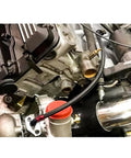 Close-up of turbo connected with Turbo Oil Drain Line Kit for T3 T4 T04E T60 T61 T70 Turbos Stainless Steel Braided Oil Line.