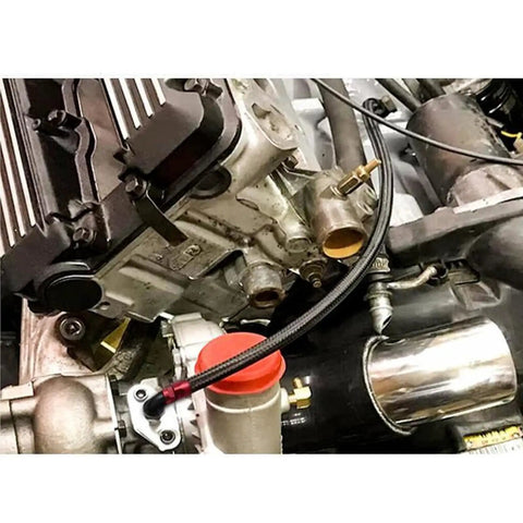 Close-up of turbo connected with Turbo Oil Drain Line Kit for T3 T4 T04E T60 T61 T70 Turbos Stainless Steel Braided Oil Line.