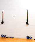 Premium Space Saver Gym Mount With One Steel Rail And One Quick Slide Car To Dominate Your Daily Grind Durable wall anchor with resistance bands.