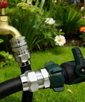 Solid Brass Five Eighths Inch Garden Hose Repair Kit With Heavy Duty Male And Female Ends connected in garden setup