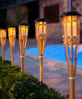 Sun Powered Bamboo Torch Lights For Outdoor Landscape 6 Pack Solar Garden Tiki Stakes illuminating pathway with warm white light