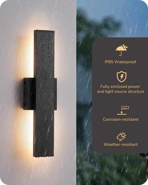 Top Shelf Led Outdoor Wall Lights Modern Black Finish adjustable with backlight, IP65 rated, in rainy outdoor setting.
