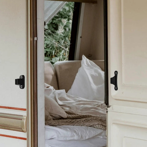Heavy Duty Tshaped Nylon Door Catch For Rv Camper Trailer And Truck holds doors securely on an RV door with a cozy interior.