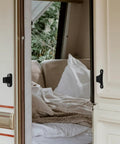 Slick Nylon Trailer Latch Kit For Rv Camper With T-Shaped Hook secured on a camper door, featuring a durable black finish.