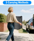 Person carrying Oversized 160L Storage Bag Organizer Waterproof Non Woven With Double Zippers And Reinforced Handles