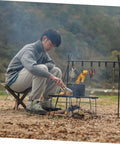 Man using Nylon Outdoor Tripod Stool Portable Camping Chair Kit With Triangle Seat And Rope Lightweight Fishing Chair For Garden Beach Picnic Travel