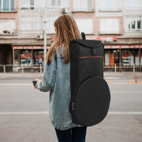 Young woman carrying Premium Drum Pad Storage Bag Featuring Slick Waterproof Fabric Cover And Smart Mesh Accessory Organizer Pouch For Snare Stand Gear Gig Ready Hella Durable Travel Case.