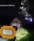 Heavy Duty 60W LED Work Light 15000 Lumens Rechargeable Waterproof Floodlamp on display with suspension lighting outdoors.