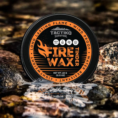 Waterproof Tinder Fire Wax For Wet Wood And Emergency Kits 60g Tin resting on rocks by a stream, packaging visible
