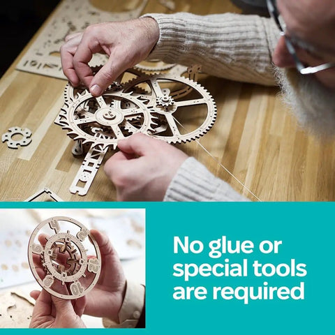 Aero Clock Wooden 3D Puzzle With Pendulum Gravity Powered Clock Kit being assembled on a wooden table, showing clock gears
